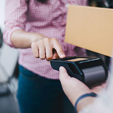 young-woman-uses-credit-card-pay-goods-223x223px